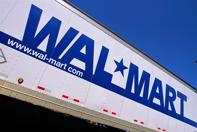 FILE - In this May 16, 2011 file photo, the Wal-Mart logo is displayed.