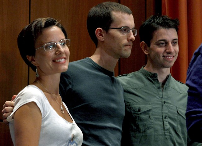 From left, Sarah Shourd, Shane Bauer, and Josh Fattal, stand together after a news conference on Sunday, Sept. 25, 2011 in New York. Fattal and Bauer, both 29, were freed last week under a $1 million bail deal and arrived Wednesday in Oman, greeted by relatives and fellow hiker Shourd, who was released last year. The two American hikers held for more than two years in an Iranian prison. (AP Photo/Craig Ruttle).