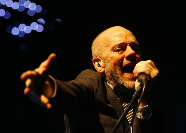 FILE – Michael Stipe, frontman of U.S. rock band R.E.M., performs on stage on Sept. 24, 2008. (AP Photo/Keystone/Steffen Schmidt)