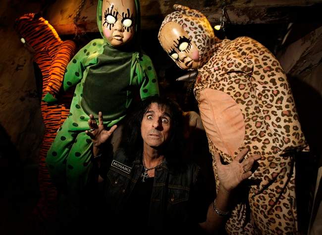 In this image released by Universal Studios Hollywood, rocker Alice Cooper poses at Universal Studios Hollywood's annual Halloween Horror Nights attraction in Los Angeles. After years of Jason, Freddy and Leatherface terrorizing visitors to the Universal Studios backlot, the designers of this year's Halloween Horror Nights have enlisted icons like Cooper, who has famously freaked out stage audiences with his band's horror-inspired theatrics for more than 40 years, to inject fresh frights into the annual theme park event. (AP Photo/Universal Studios Hollywood, David Sprague).