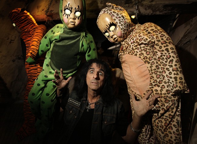 In this image released by Universal Studios Hollywood, rocker Alice Cooper poses at Universal Studios Hollywood's annual Halloween Horror Nights attraction in Los Angeles. After years of Jason, Freddy and Leatherface terrorizing visitors to the Universal Studios backlot, the designers of this year's Halloween Horror Nights have enlisted icons like Cooper, who has famously freaked out stage audiences with his band's horror-inspired theatrics for more than 40 years, to inject fresh frights into the annual theme park event. (AP Photo/Universal Studios Hollywood, David Sprague).