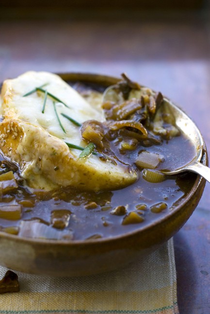 This Sept. 12, 2011 photo shows French onion and mushroom soup in Concord, N.H. French onion soup is a classic well suited for fall. The dark, rich broth and cheese-encrusted top are perfect for fending off a chilly evening. (AP Photo/Matthew Mead).