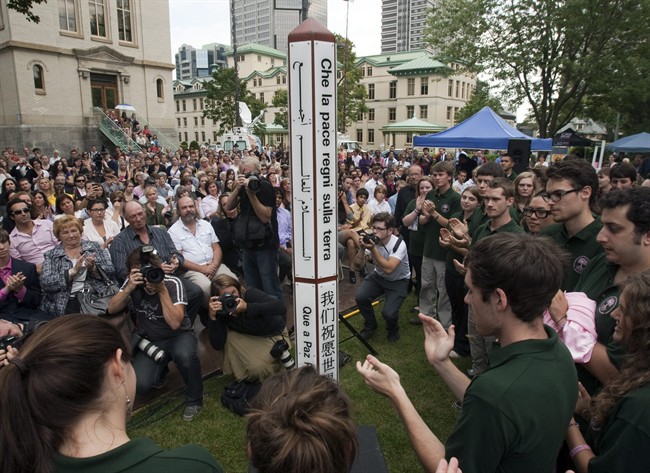 Students unveil a peace pole as they inaugurate the peace garden at Dawson College Tuesday, September 13, 2011 in Montreal to mark the fifth anniversary of the shooting rampage that left one student dead and nineteen injured..THE CANADIAN PRESS/Ryan Remiorz.