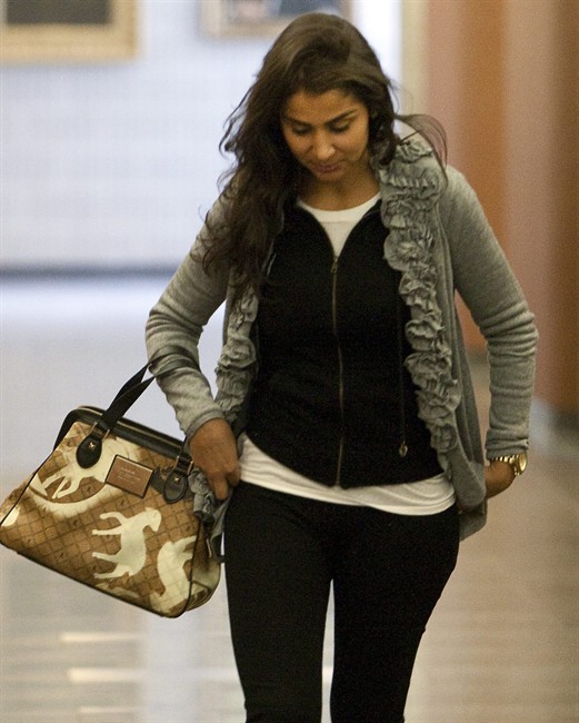 Amanda Rodrigues, widow of the late former boxing champion Arturo Gatti, takes a break from proceedings at the Montreal courthouse where a civil case has begun to determine the beneficiary of Gatti's estate Wednesday, September 14, 2011 in Montreal.THE CANADIAN PRESS/Ryan Remiorz.