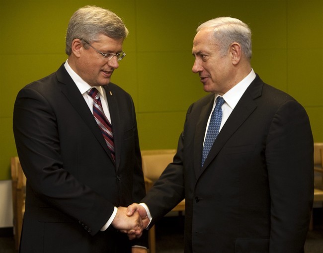 Prime Minister Stephen Harper, left, shakes hands with Israel's Prime Minister Benjamin Netanyahu during a bilateral meeting at the United Nations Wednesday, September 21, 2011.THE CANADIAN PRESS/Ryan Remiorz.