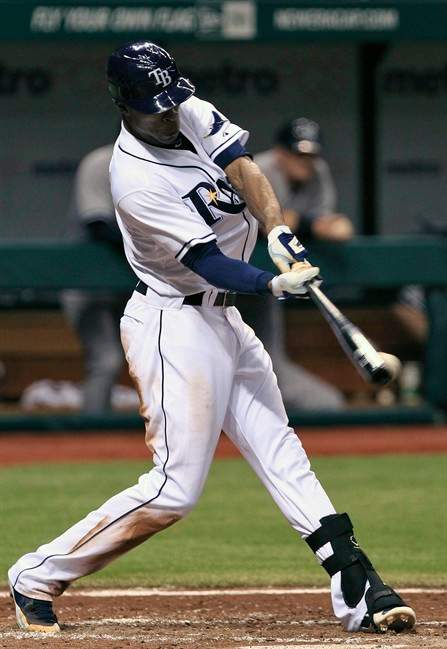 Tampa Bay Rays' B.J. Upton swings on a third-inning, two-run double off New York Yankees starting pitcher Hector Noesi during a baseball game Monday, Sept. 26, 2011, in St. Petersburg, Fla. (AP Photo/Chris O'Meara).