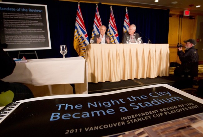 Former Nova Scotia deputy attorney general Douglas Keefe, left, and former head of the Vancouver Olympic Committee John Furlong speak after releasing their report into the Stanley Cup Riot in Vancouver, B.C., on Thursday September 1, 2011. THE CANADIAN PRESS/Darryl Dyck.