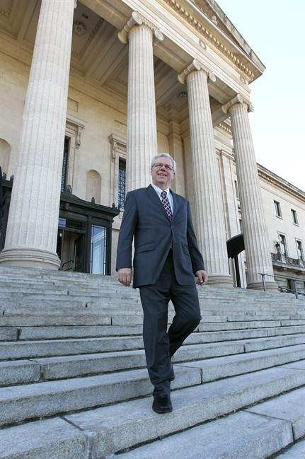 Manitoba Premier Greg Selinger embarks on the short walk from the provincial legislature to Government House in Winnipeg on Tuesday, Sept. 6, 2011 to visit Lt.-Gov. Philip Lee to officially drop the writ and kick off the formal campaign for a general election to be held Oct. 4, 2011. THE CANADIAN PRESS/Jason Halstead.
