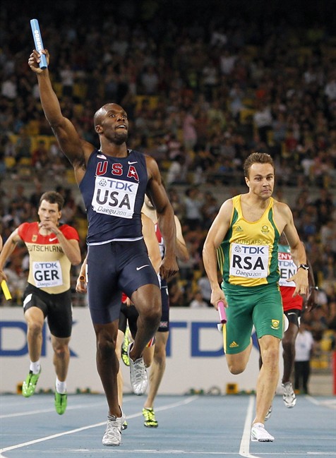 USA's LaShawn Merritt, center, crosses the finish line to win ahead of South Africa's L.J. van Zyl, right, and Germany's Thomas Schneider, left, in the Men's 4x400m Relay final at the World Athletics Championships in Daegu, South Korea, Friday, Sept. 2, 2011. (AP Photo/Anja Niedringhaus).