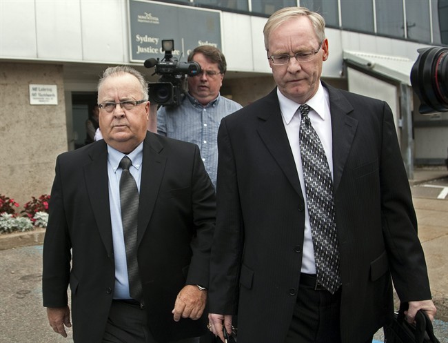 Dave Wilson, left, accompanied by his lawyer Stephen O'Leary, heads from court in Sydney, N.S. on Tuesday, Sept. 13, 2011. Wilson, a former member of the Nova Scotia legislature, has pleaded guilty to fraud, uttering forged documents and breach of trust in the province's spending scandal. THE CANADIAN PRESS/Andrew Vaughan.