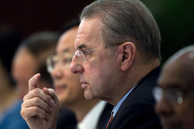 Jacques Rogge, president of International Olympic Committee, gestures during a press conference in Beijing, China, Friday, Sept. 23, 2011. Rogge on Friday welcomed an investigation by amateur boxing's governing body into allegations that millions of dollars have been paid to guarantee Azerbaijan two gold medals in the ring at next year's London Olympics. (AP Photo/Alexander F. Yuan).