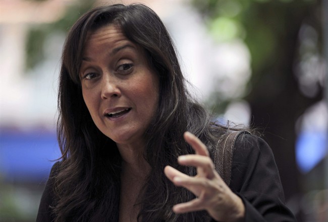 In this photo taken Sept. 14, 2011, Venezuelan activist Rocio San Miguel, who leads a private organization focused on national security and defense issues, talks during a conference in Caracas, Venezuela. Venezuela's political battle is playing out in a new way on Twitter, where the accounts of at least nine critics of President Hugo Chavez, San Miguel's included, have been mysteriously taken over by hackers who post pro-government messages along with insults and threats. (AP Photo/Fernando Llano).