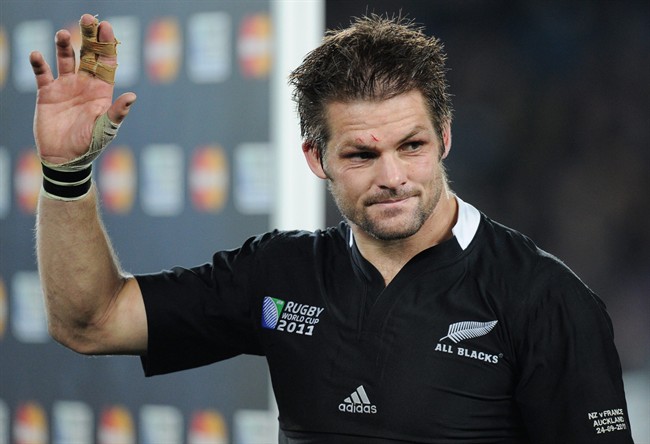 New Zealand All Blacks captain Richie McCaw salutes the crowd after their Rugby World Cup game against France at Eden Park, Auckland, New Zealand, Saturday, Sept. 24, 2011. (AP Photo/Ross Land).