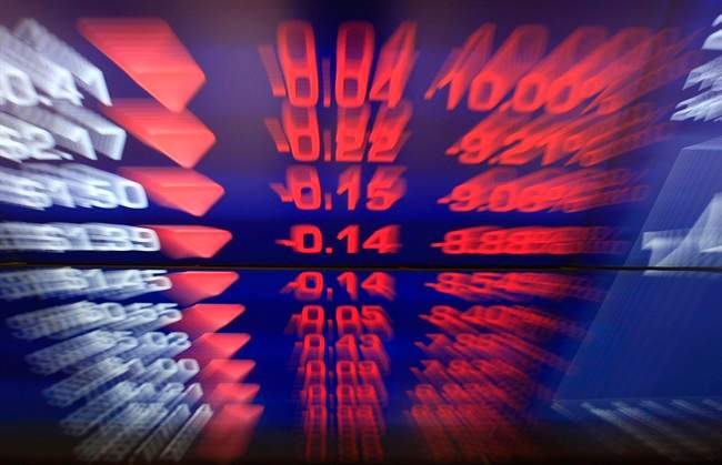 Display boards at the Australian Stock Exchange flash news of a falling market in Sydney, Friday, Sept. 23, 2011. 