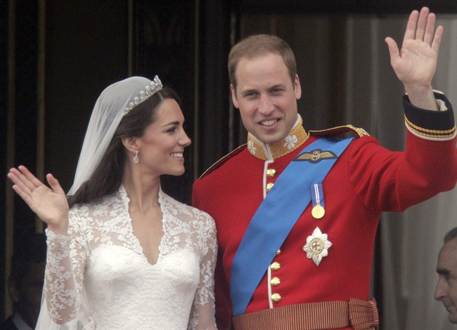 Britain’s Prince William, right, and Kate, Duchess of Cambridge wave from the balcony of Buckingham Palace after their wedding service at Westminster Abbey in London, in this April, 29, 2011, file photo. THE CANADIAN PRESS/AP, Lefteris Pitarakis