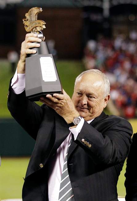 Texas Rangers president Nolan Ryan holds the American League championship trophy after winning Game 6 of baseball's AL championship series against the Detroit Tigers 15-5, Saturday, Oct. 15, 2011, in Arlington, Texas. Texas moves on to the world series. (AP Photo/Charlie Riedel).