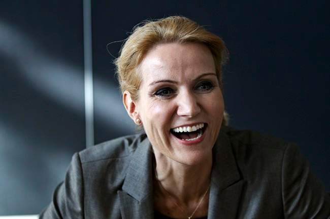 Leader of the Danish Social Democrats Helle Thorning-Schmidt smiles at Christiansborg Palace in Copenhagen on Sunday, Oct. 2, 2011. The negotiations of the new Danish Government has ended, and it will be presented to Danish Queen Margrethe and the public Monday. Helle Thorning-Schmidt will be the first female Prime Minister in Denmark. (AP Photo/POLFOTO, Jens Dresling) DENMARK OUT.