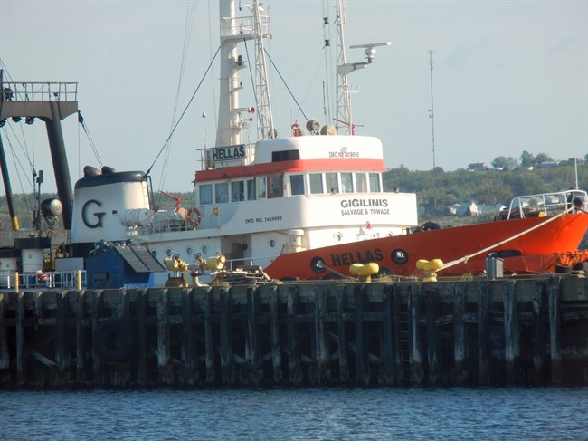 The tug ship is shown at port in this photo released by the Nova Scotia Government on Thursday Oct. 13, 2011. The Nova Scotia government is going after the Greek owners of a tugboat in a bid to remove a vessel that became grounded on a Cape Breton island while being towed. THE CANADIAN PRESS/HO.