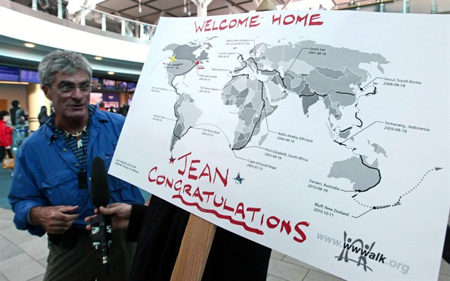 Jean Beliveau, who left home 11 years ago to walk around the world, expects to complete his improbable journey this weekend. A map details his journey as Beliveau speaks to reporters after he arrived back in Canada at Vancouver International Airport in Richmond, B.C., on Sunday January 30, 2011. THE CANADIAN PRESS/Darryl Dyck.