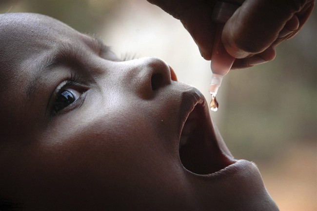 A slum dweller is administered drops of polio vaccine at a health center at Saliasahi, Bhubaneswar, India, Sunday, Jan. 10, 2010. 