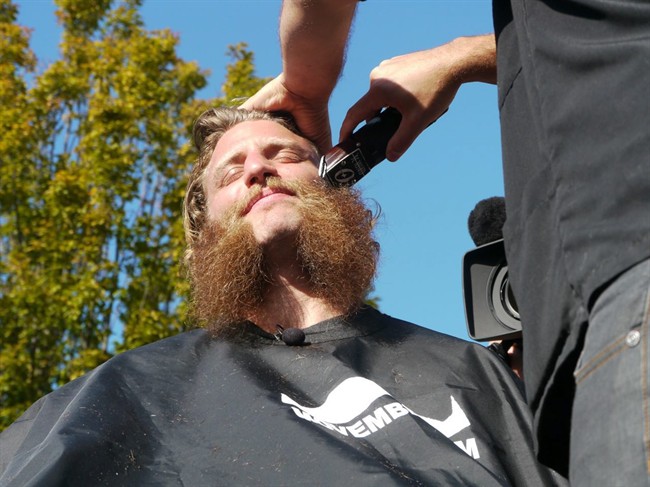 Adam Kleeberger gets his beard shaved for charity on Monday Oct. 17, 2011 at the University of Victoria. Kleeberger, who became known worldwide as "Grizzly Adam" for his wildman beard at the world rugby championships in New Zealand, was cheered on by hundreds of students Monday as the beard came off at the University of Victoria to raise funds for cancer research. THE CANADIAN PRESS/HO, Vikes Athletics - Ali Lee.
