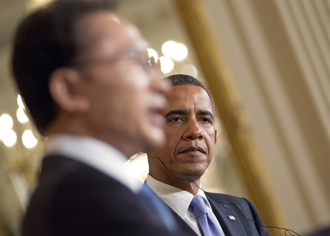 President Barack Obama and South Korean President Lee Myung-bak take part in a joint news conference, Thursday, Oct. 13, 2011, in the East Room of White House in Washington. (AP Photo/Evan Vucci).