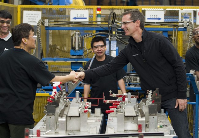 Ontario Liberal Leader Dalton McGuinty greets auto parts workers during a campaign event in Vaughan, Ontario on Monday October 3, 2011. THE CANADIAN PRESS/Frank Gunn.