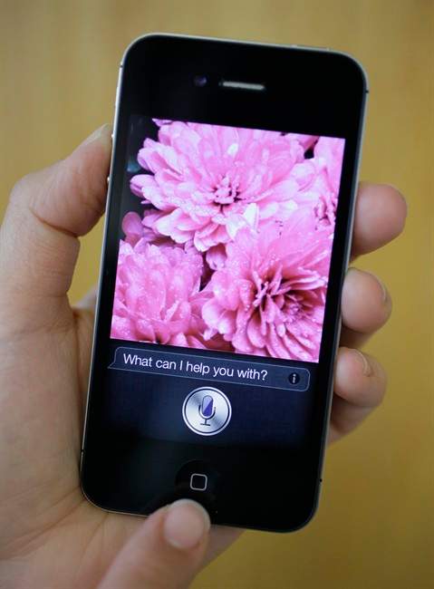 In this photo taken Monday Oct. 10, 2011, Siri, the new virtual assistant, is displayed on the new Apple iPhone 4S in San Francisco. The 4S will be available Friday in black or white. It will cost $199-$399, depending on included storage space, with a two-year service contract with Verizon Wireless, Sprint or AT&T. (AP Photo/Eric Risberg).
