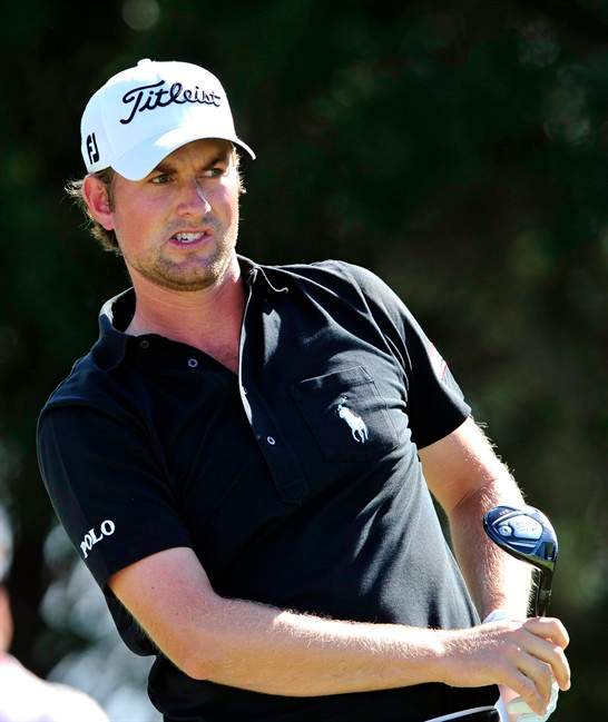 Webb Simpson watches his drive off the 10th tee during the third round of the McGladrey Classic golf tournament at the Sea Island Golf Club on St. Simons Island, Ga., Saturday, Oct. 15, 2011. (AP Photo/Stephen Morton).