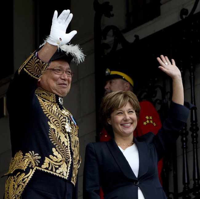 Lieutenant Governor Steven Point and B.C. Premier Christy Clark wave to onlookers prior to Point delivering the Speech from the Throne at the Legislature in Victoria, B.C. Monday, Oct. 3, 2011. THE CANADIAN PRESS/Jonathan Hayward.