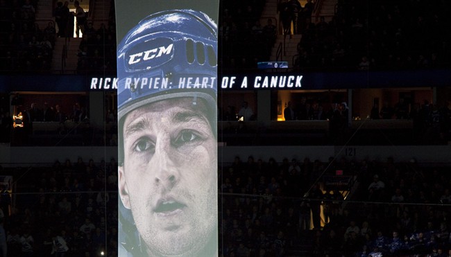 A giant banner with the picture of former Vancouver Canuck Rick Rypien is seen during a ceremony prior to a game against the New York Rangers at Rogers Arena in Vancouver, B.C. Tuesday, Oct.18, 2011. Rypien died earlier this year. THE CANADIAN PRESS/Jonathan Hayward.
