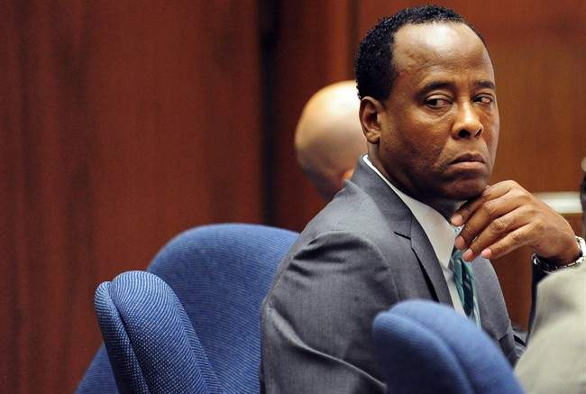 Dr. Conrad Murray looks behind during his involuntary manslaughter trial, Thursday, Oct. 13, 2011, in downtown Los Angeles. Murray has pleaded not guilty and faces four years in prison and the loss of his medical license if convicted of involuntary manslaughter in Michael Jackson's death. (AP Photo/Robyn Beck, Pool).