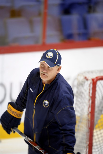 Lindy Ruff, head coach of the Buffalo Sabres observes players during the team's practice session in Helsinki, Finland on Wednesday Oct. 5, 2011 prior their NHL season opener against Anaheim Ducks in Helsinki on Friday Oct. 7. (AP Photo/LEHTIKUVA, Martti Kainulainen) FINLAND OUT - NO SALES.