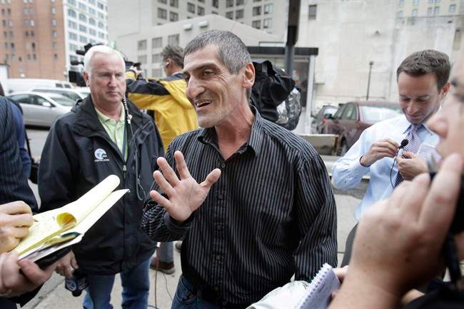 Dimitrios Bessis talks to the media outside federal court in Detroit, Wednesday, Oct. 12, 2011. Bessis was a passenger on the Detroit bound plane from Amsterdam on Christmas, 2009 when Umar Farouk Abdulmutallab attempted to blow the plane on approach at the Detroit airport with a bomb in his underwear. Abdulmutallab pleaded guilty on all counts Wednesday during the trials second day. (AP Photo/Carlos Osorio).