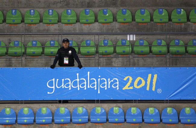 A police officer stands inside the Pan American games gymnastic center in Guadalajara, Mexico, Thursday, Oct. 13, 2011. The 2011 Guadalajara Pan American games will be held Oct. 14 - 30. (AP Photo/Eduardo Verdugo).