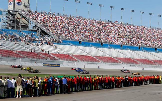 Drivers take five tribute laps in honor of Dan Wheldon, a two-time Indianapolis 500 winner who died following a crash in the IndyCar Series' Las Vegas Indy 300 auto race earlier Sunday, Oct. 16, 2011, in Las Vegas. (AP Photo/Isaac Brekken).