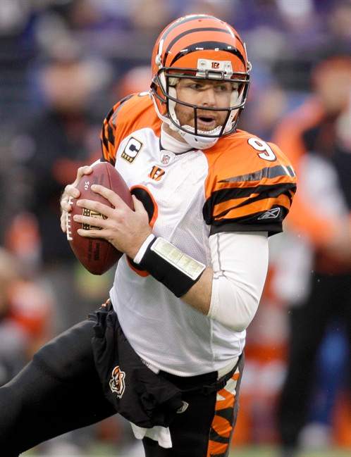 FILE - In this Jan. 2, 2011, file photo, Cincinnati Bengals quarterback Carson Palmer rolls out to pass during the first half of an NFL football game against the Baltimore Ravens in Baltimore. The Bengals reversed course and negotiated a trade Tuesday, Oct. 28, 2011, that would send Palmer to the Oakland Raiders, a source familiar with the discussions told The Associated Press. (AP Photo/Rob Carr, File).
