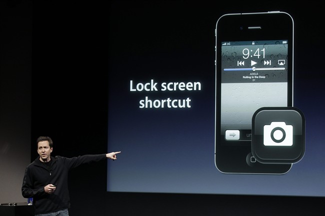 FILE - In this Oct. 4, 2011 file photo, Apple's Scott Forstall, talks about camera on the Apple iPhone 4S during an announcement at Apple headquarters in Cupertino, Calif. Apple Inc., announced Mondy, Oct. 10, 2011, pre-orders of its iPhone 4S have topped one million in a single day, surpassing the previous single day pre-order record of 600,000 held by iPhone 4.(AP Photo/Paul Sakuma, File).