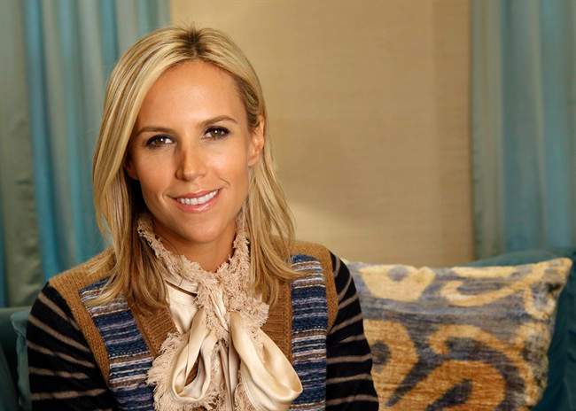 Fashion designer Tory Burch is shown in her flagship women's clothing store on Madison Avenue in New York, Tuesday, Sept. 20, 2011. Since the launch of her label eight years ago, Burch has offered a consistent mix of everyday outfits, including printed tunics and tailored trousers, big handle handbags, strategic sequins and ballet flats. (AP Photo/Kathy Willens).
