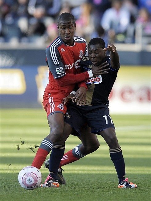 Toronto FC's Andy Iro (3) collides with Philadelphia Union's Freddy Adu (11) during the first half of an MLS soccer match, Saturday, Oct. 15, 2011, in Chester, Pa. (AP Photo/Michael Perez).