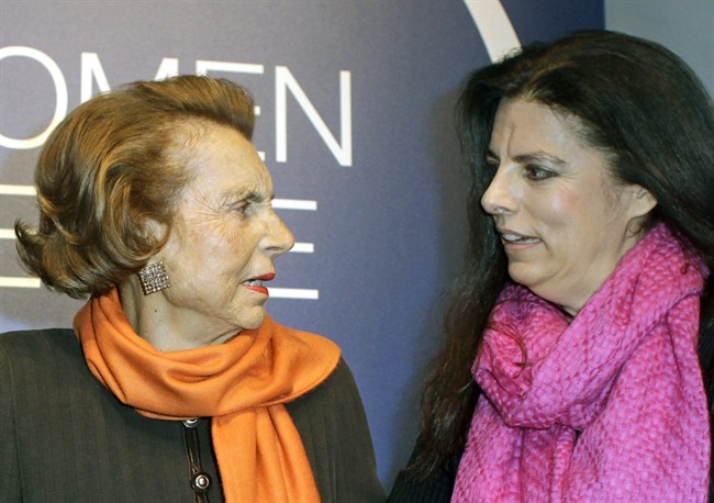 FILE - In this March 3 2011 file photo, L'Oreal heiress Liliane Bettencourt, left, and her daughter Francoise Meyers-Bettencourt arrive to the L'Oreal-UNESCO prize for the women in science, in Paris. Lawyers for L'Oreal heiress Liliane Bettencourt said Monday Oct. 17, 2011, a judge ordered the 88-year-old French billionaire and her fortune placed under the legal protection of her daughter and grandsons. (AP Photo/Thibault Camus, File).