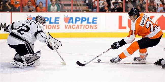 Los Angeles Kings goalie Jonathan Quick, left, challenges Philadelphia Flyers' James van Reimsdyk who tries to score in the second period of an NHL hockey game, Saturday, Oct. 15, 2011, in Philadelphia. (AP Photo/Tom Mihalek).