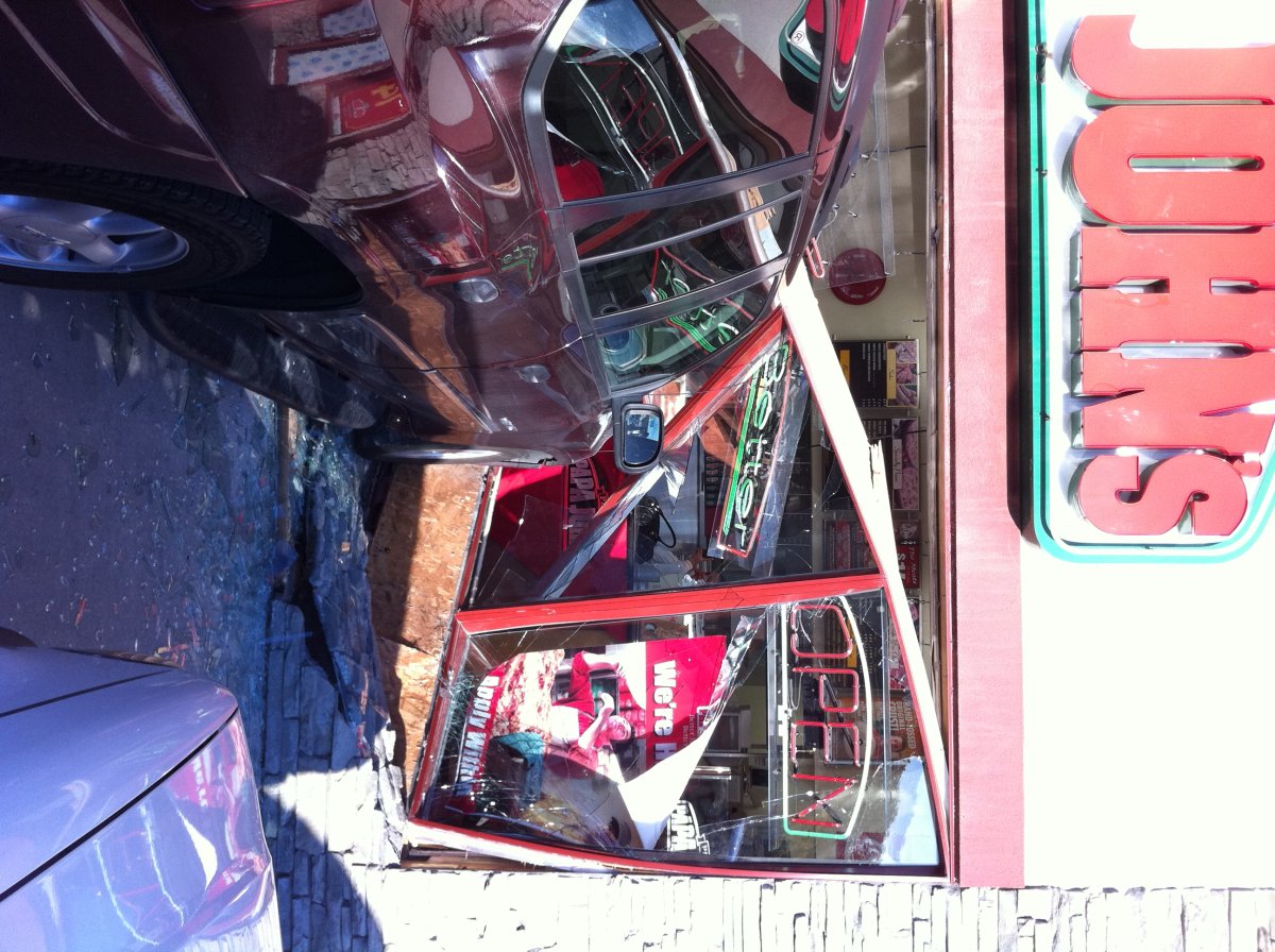 Vehicle crashes through south Calgary pizza shop - image