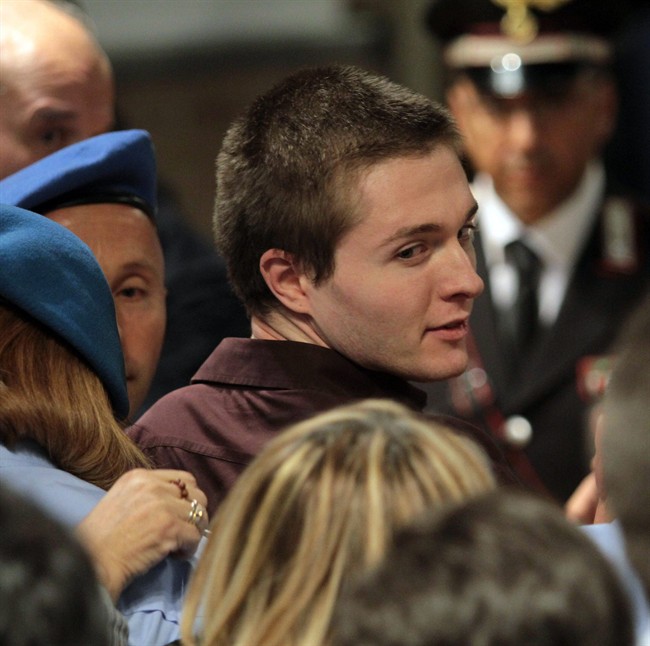 Raffaele Sollecito reacts following the verdict that overturns his conviction and acquits him of murdering his British roomate Meredith Kercher, at the Perugia court, Italy, Monday Oct. 3, 2011. An Italian appeals court has thrown out Amanda Knox's murder conviction and ordered the young American freed after nearly four years in prison for the death of her British roommate. Knox collapsed in tears after the verdict was read out Monday. Her co-defendant, Raffaele Sollecito, also was cleared of killing 21-year-old Meredith Kercher in 2007. (AP Photo/Pietro Crocchioni, Pool).