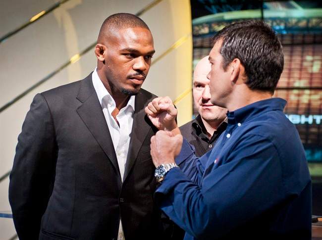 Light-heavyweight champion Jon Jones (left to right), UFC President Dana White, and Lyoto Machida attend a news conference promoting UFC140 in Toronto, Wednesday, Oct.12, 2011. THE CANADIAN PRESS/Ryan Enn Hughes.