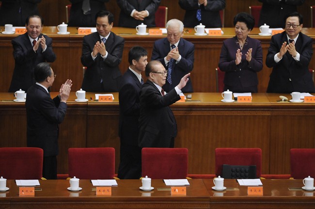 Former President Jiang Zemin, center, waves as he attends a conference to commemorate the centennial of the 1911 Revolution that overthrew imperial rule on the mainland, at the Great Hall of the People in Beijing on Sunday Oct. 9, 2011. China's retired President Jiang Zemin has made a rare public appearance at the Beijing ceremony months after speculation that he had died or was close to death. (AP Photo/Minoru Iwasaki, Pool).