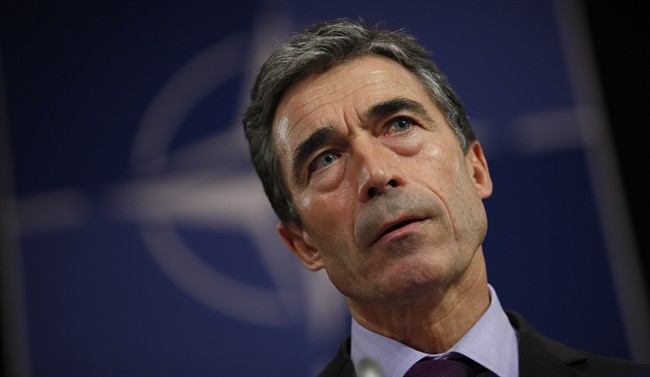 NATO Secretary General Anders Fogh Rasmussen listens to questions during a media conference at NATO headquarters in Brussels on Monday, Oct. 3, 2011.  (File photo).