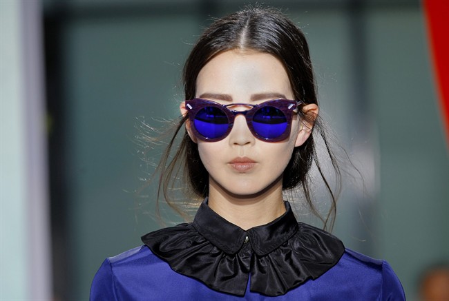 A model displays a creation by fashion designers Humberto Leon and Carol Lim for Kenzo spring-summer 2012 ready to wear collection presented Sunday, Oct. 2, 2011, in Paris. (AP Photo/Jacques Brinon).