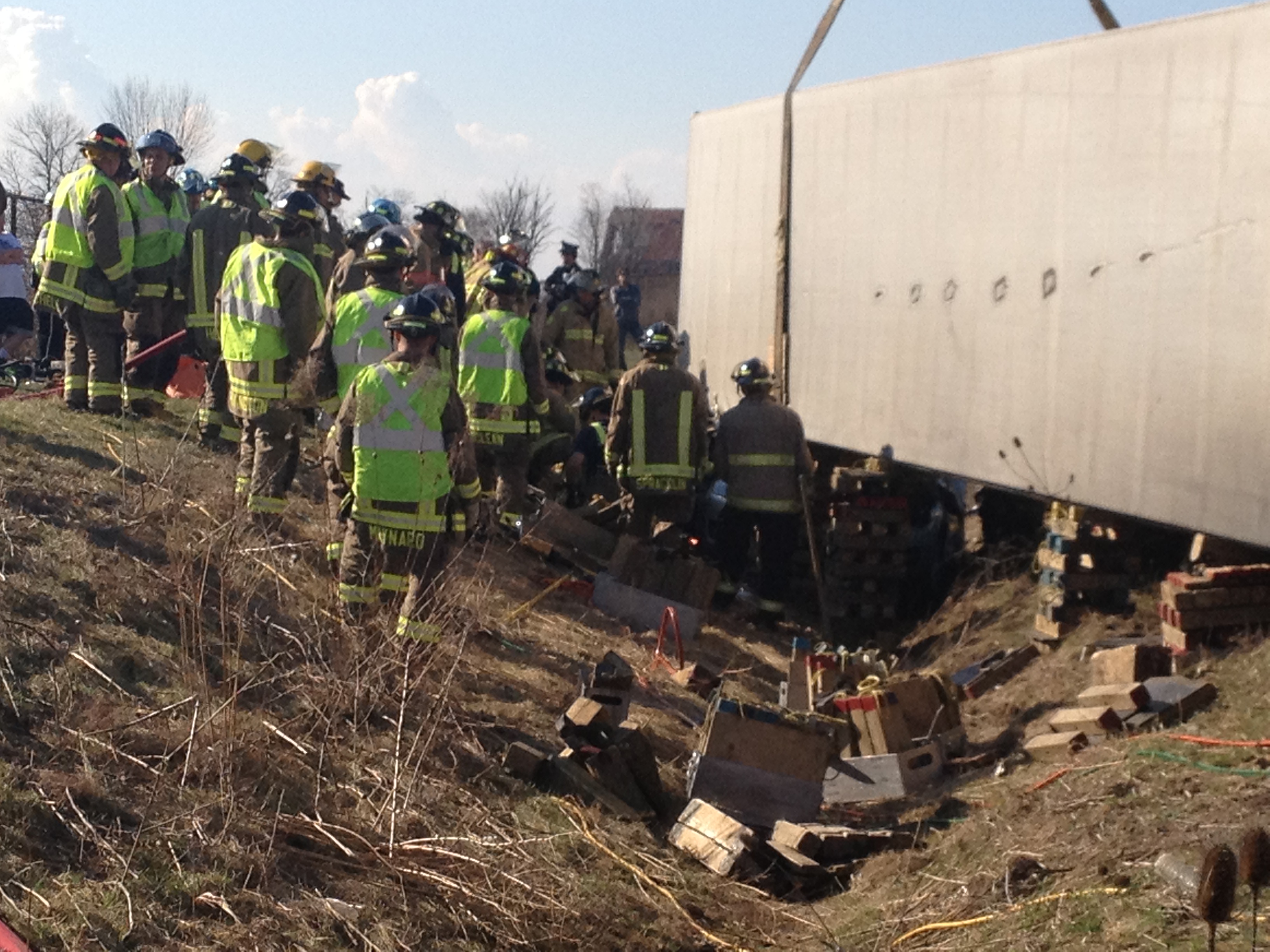 Woman rescued after being trapped underneath a tractor trailer ...