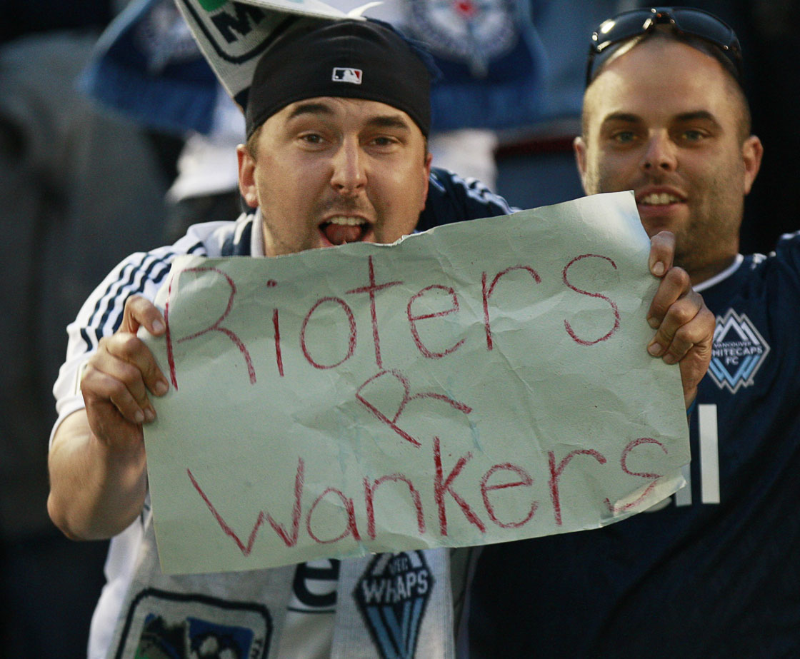 A Whitecaps fan holds up a sign putting down the Stanley Cup rioters during the MLS game between the Vancouver Whitecaps FC and the Philadelphia Union June 18, 2011 in Vancouver, British Columbia, Canada. 